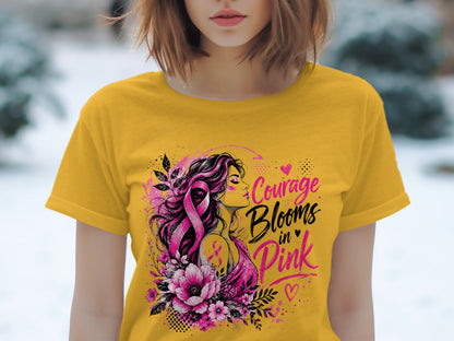 Yellow t-shirt with graphic "Courage Blooms in Pink" and woman with pink ribbon.