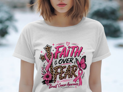White t-shirt with "Faith Over Fear Breast Cancer Awareness" graphic featuring a cross, butterfly, and pink ribbons.