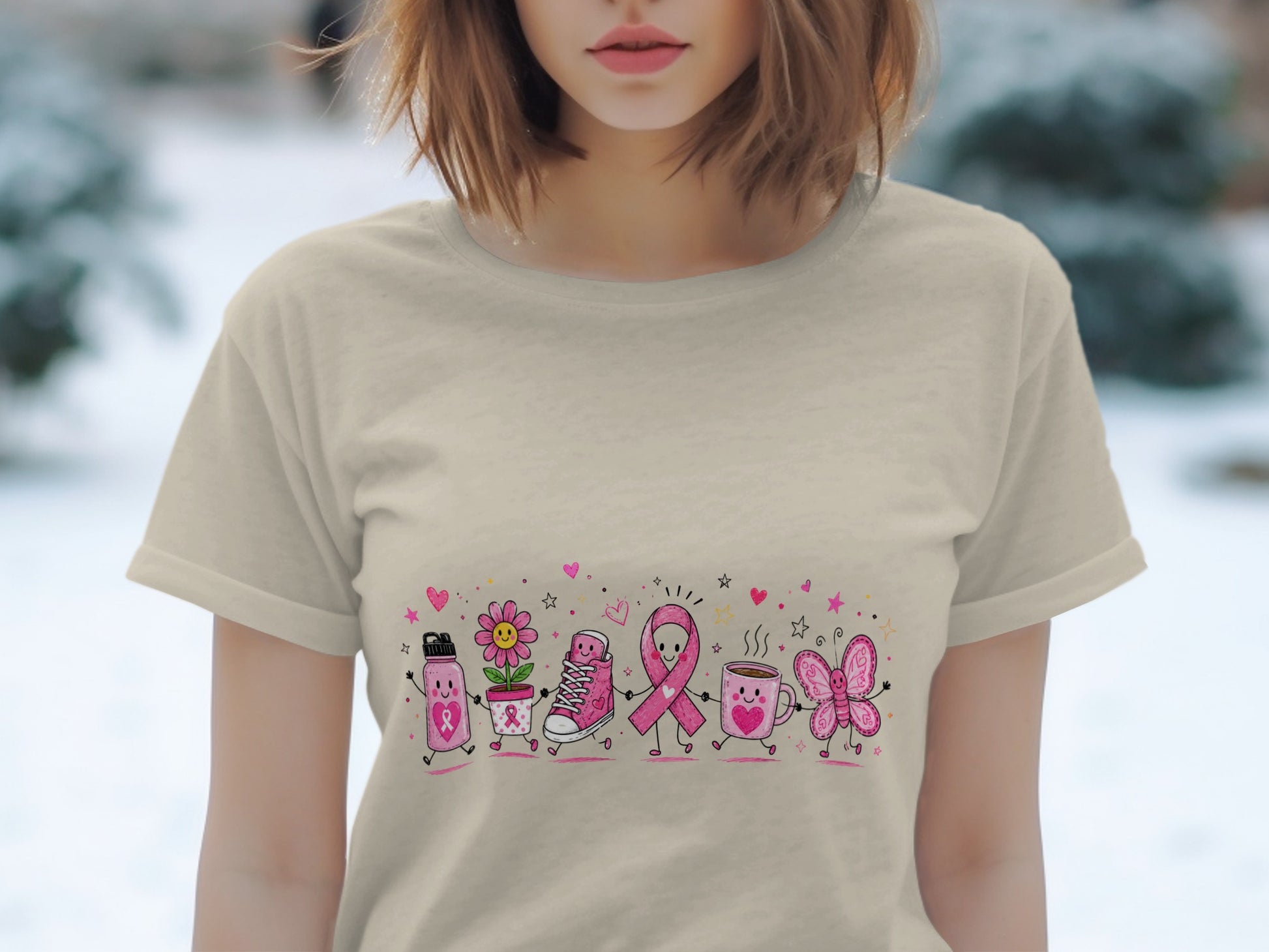 T-shirt with cartoon pink ribbon characters, flower, sneaker, mug, and butterfly.