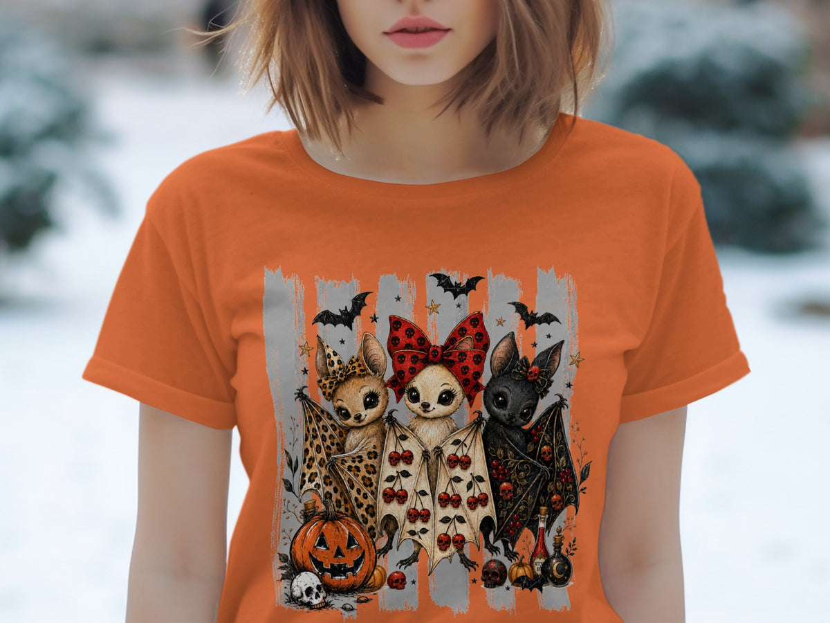 Three cartoon bats with Halloween motifs stand in front of grey stripes.