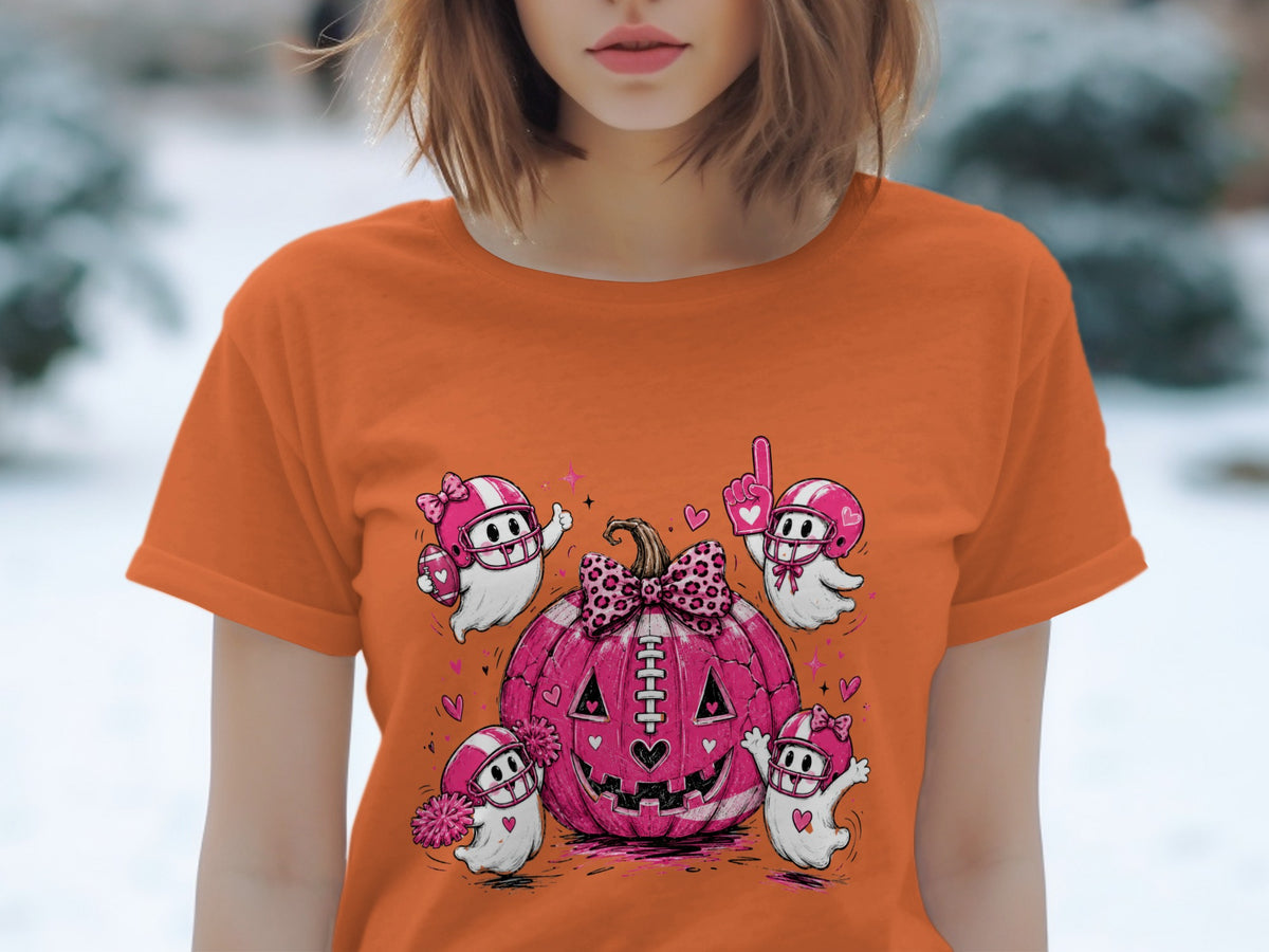 Pink football pumpkin with four playful ghosts in football helmets and accessories.
