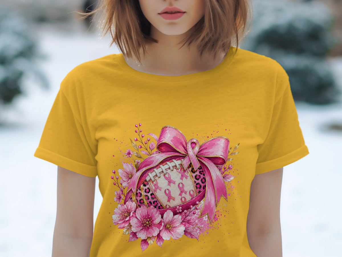 Yellow t-shirt with football graphic featuring pink ribbons and flowers.
