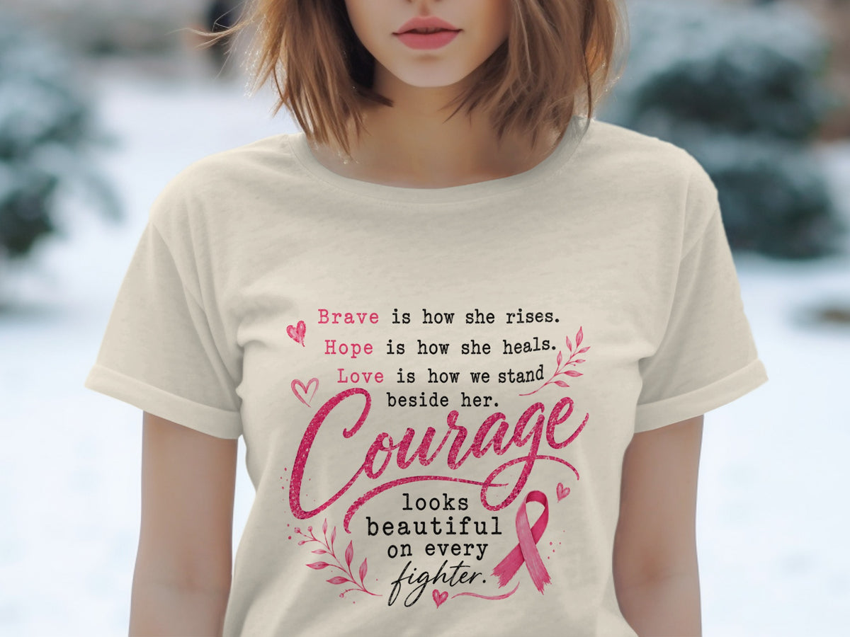 Cream t-shirt with pink text about bravery, hope, love, and courage with a pink ribbon.