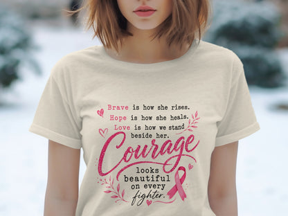 Cream t-shirt with pink text about bravery, hope, love, and courage with a pink ribbon.