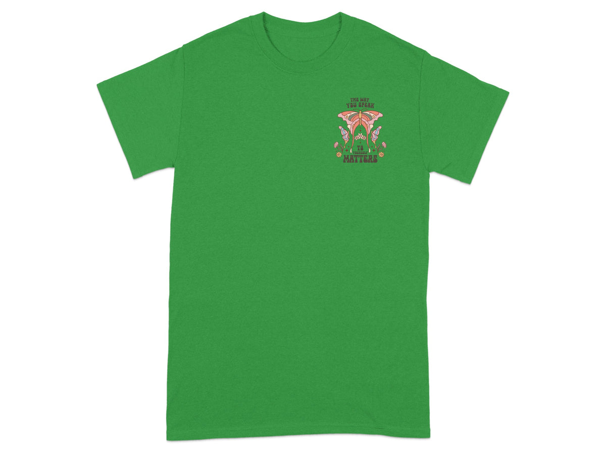 Green t-shirt with butterfly graphic and text "The way you speak to yourself matters".