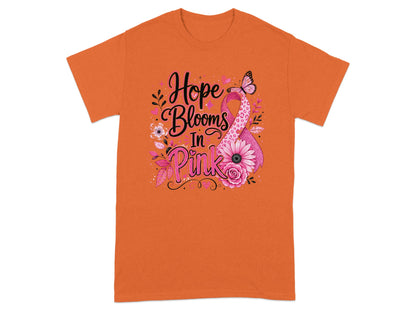 Orange t-shirt with "Hope Blooms In Pink" and a pink ribbon with flowers.