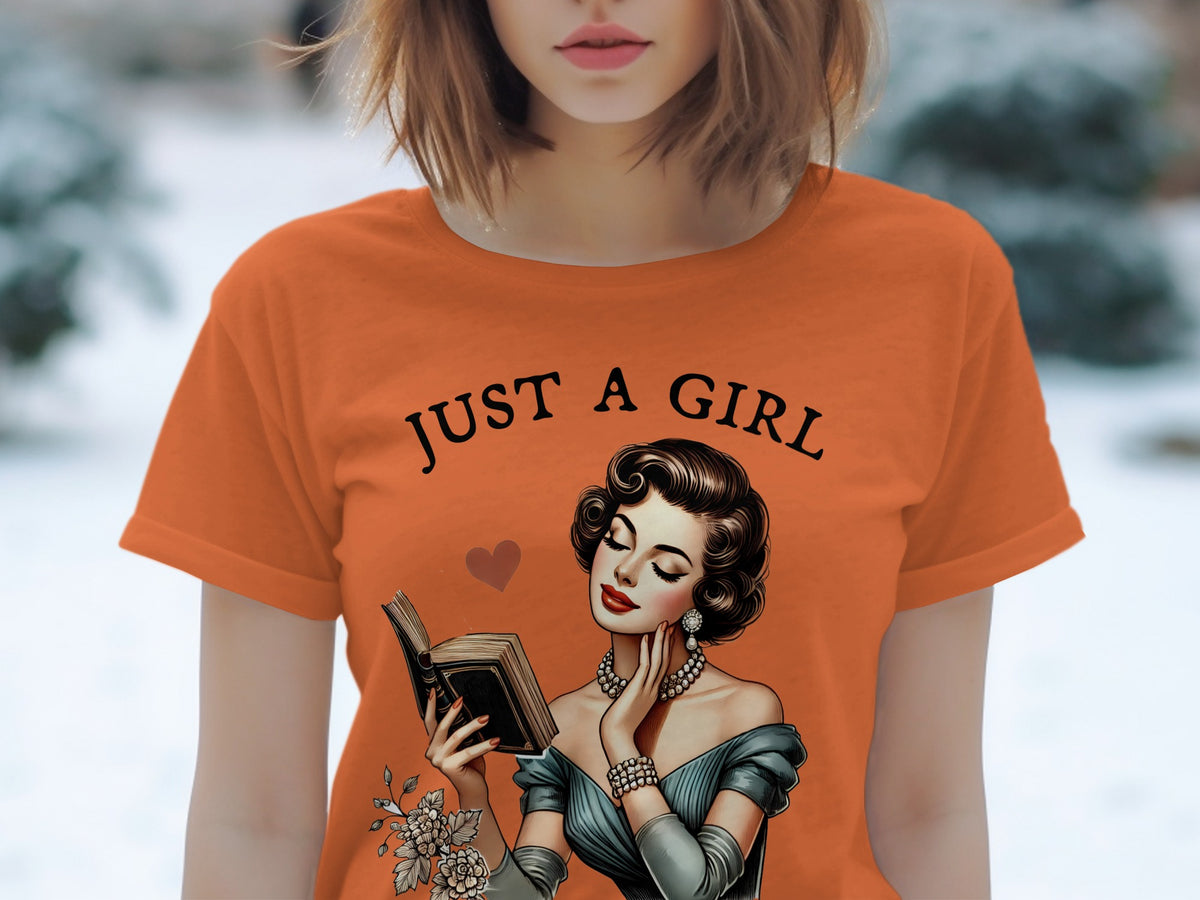 Orange t-shirt with "JUST A GIRL" and vintage woman reading a book.