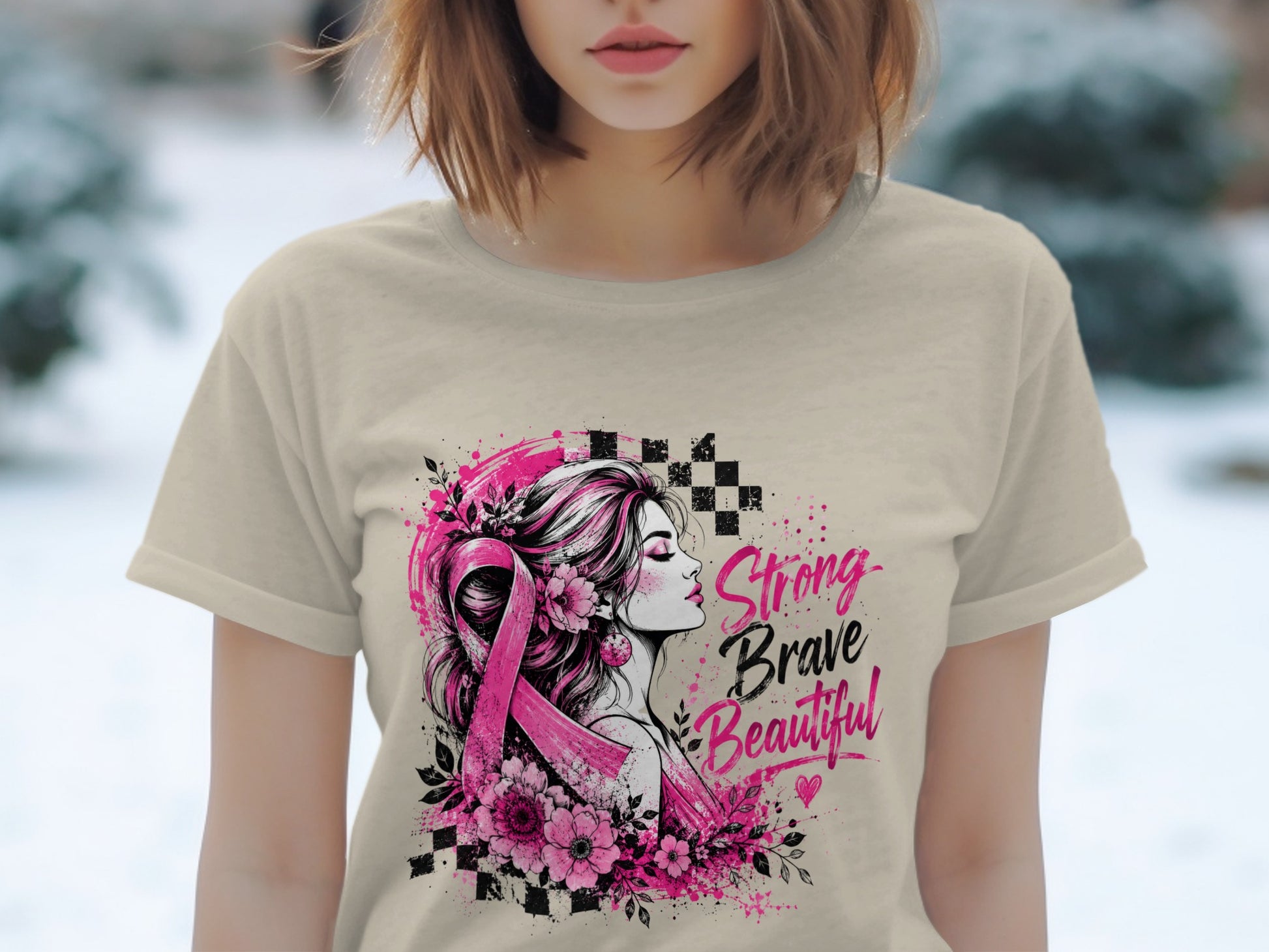 T-shirt graphic with woman, pink ribbon, flowers, and text: Strong Brave Beautiful.
