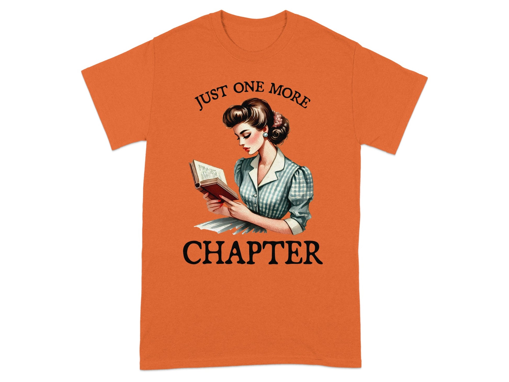 Orange t-shirt with vintage woman reading a book and text "JUST ONE MORE CHAPTER".