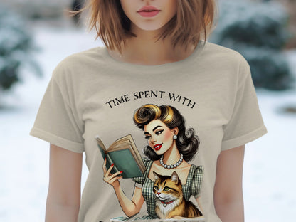 T-shirt graphic: retro woman reading book with cat, text "TIME SPENT WITH"