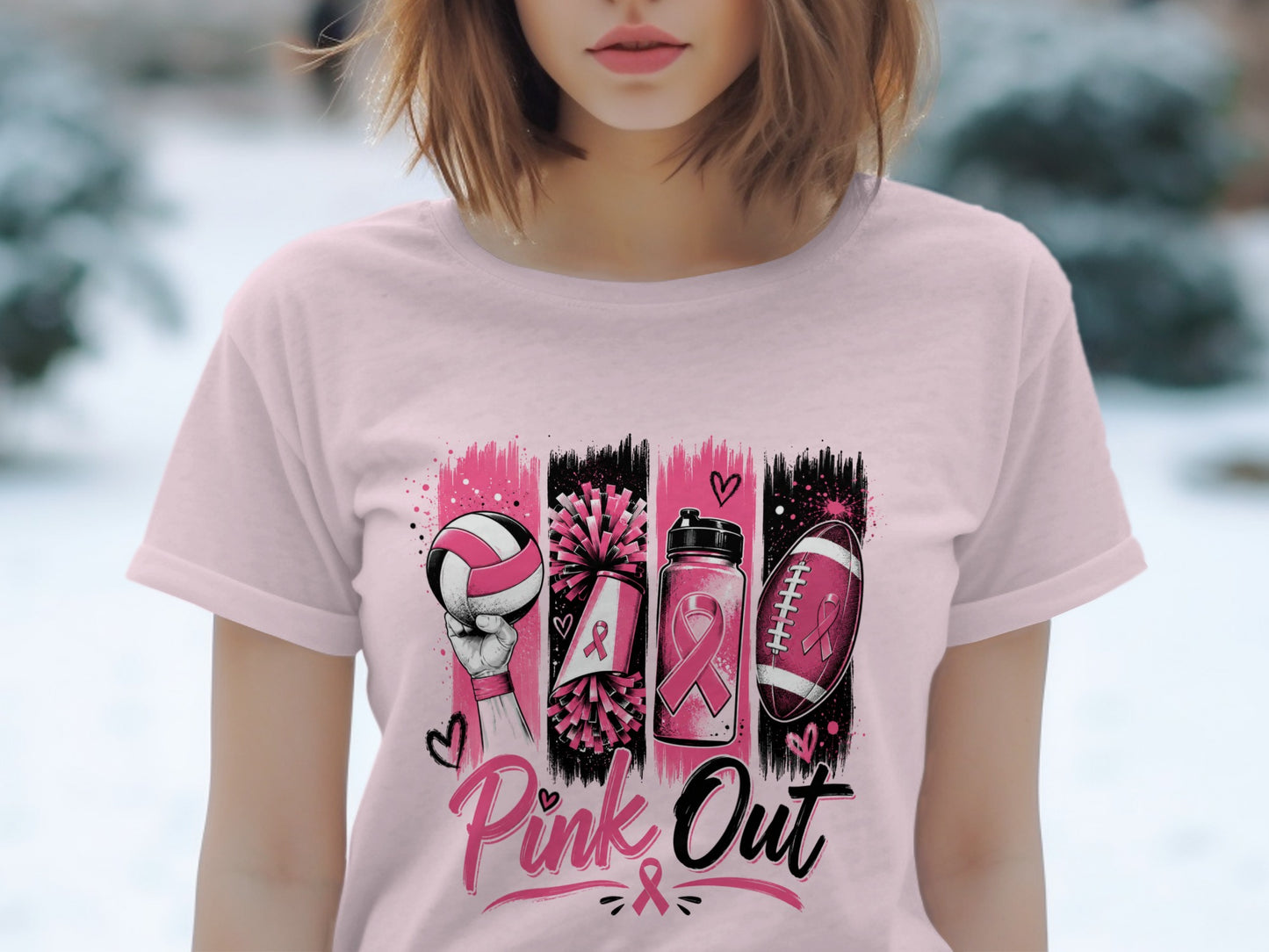 Pink Out graphic on a pink t-shirt featuring volleyball, pom-poms, water bottle, and football with ribbons.