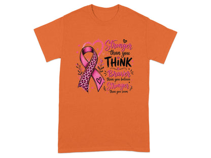 Orange t-shirt with a pink ribbon and inspirational text about strength.