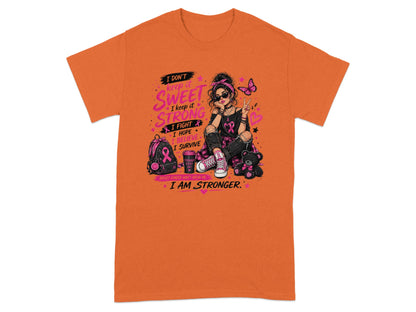 Orange t-shirt with a graphic of a woman and breast cancer awareness elements.