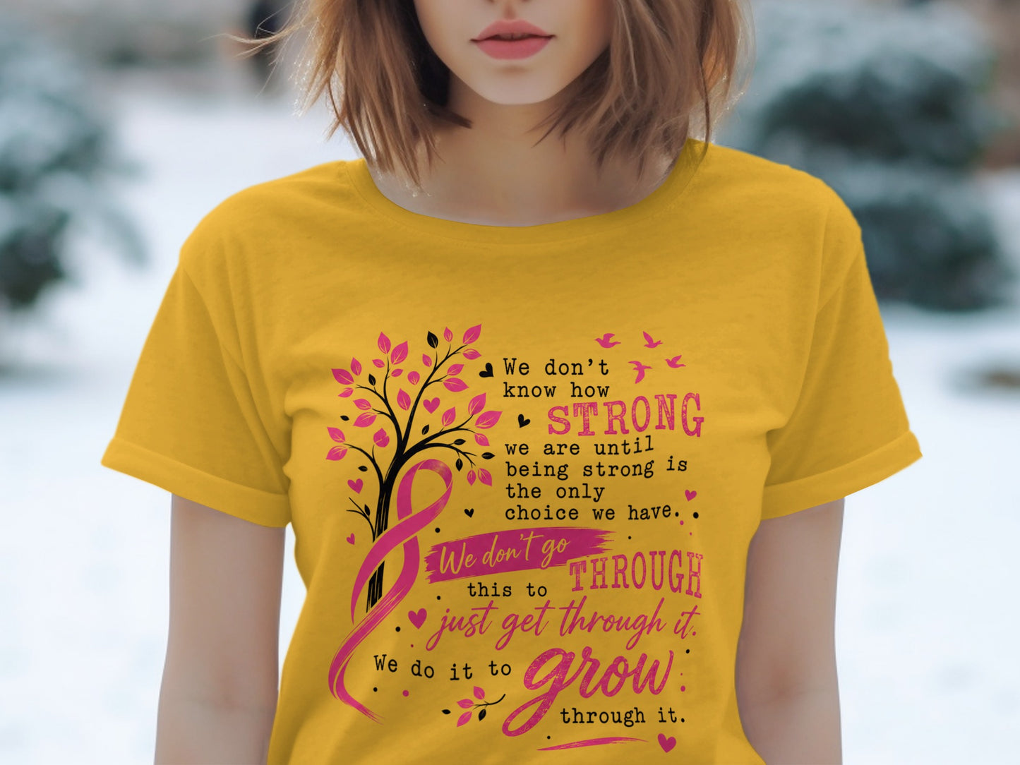 Yellow t-shirt with text about strength, breast cancer ribbon, and a tree.