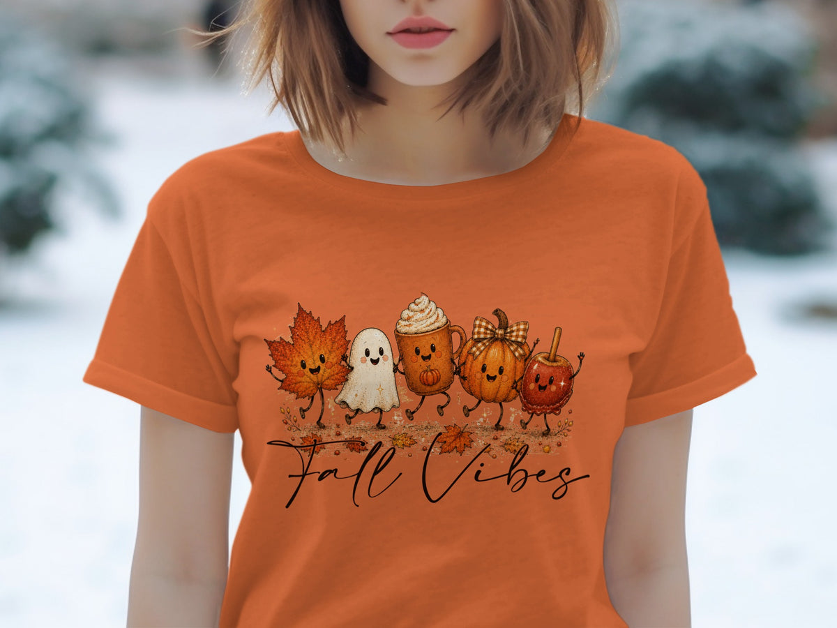 Orange t-shirt with cartoon fall characters and "Fall Vibes" text.