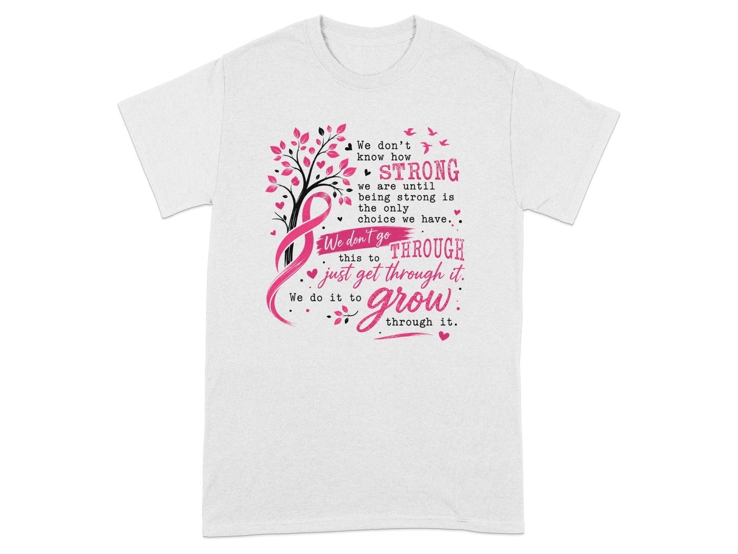 White t-shirt with pink ribbon, tree, and quote about strength and growing through challenges.