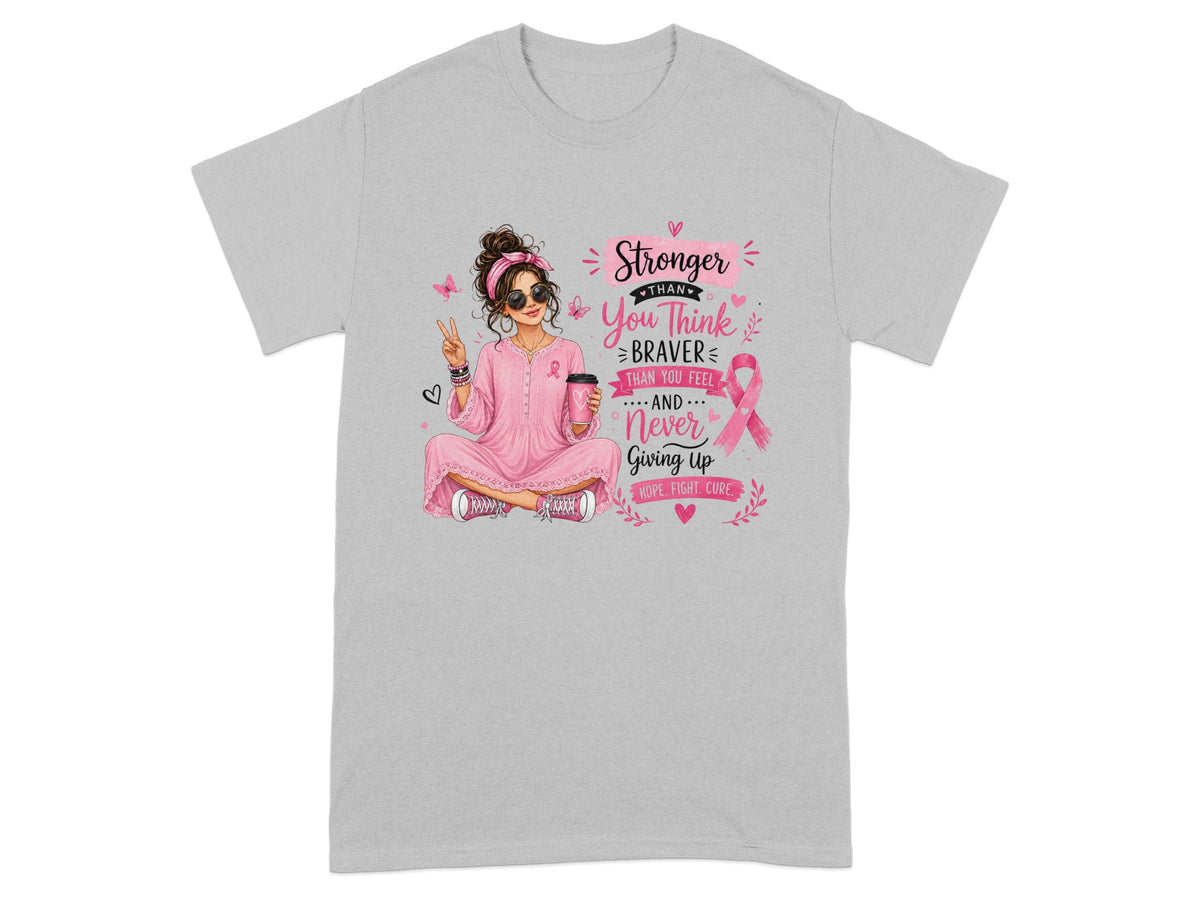 Woman in pink with coffee cup and text: Stronger, You Think, Braver Than You Feel, Never Giving Up, Hope, Fight, Cure.