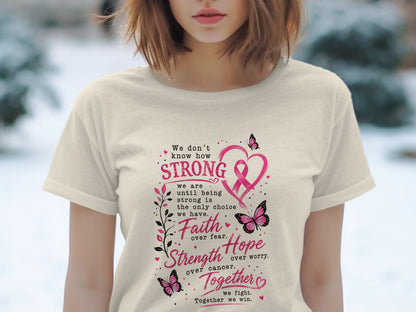 Cream t-shirt with pink text and graphics about strength, faith, hope, and fighting cancer.