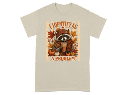 Raccoon in autumn scarf holding drink, with text "I IDENTIFY AS A PROBLEM".