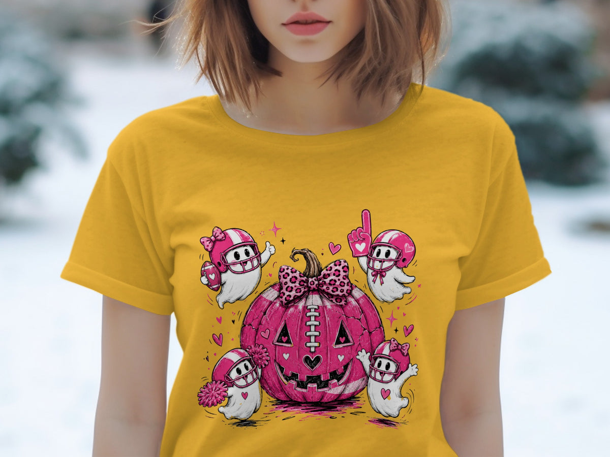Yellow t-shirt featuring a pink football pumpkin with four football-themed ghosts.