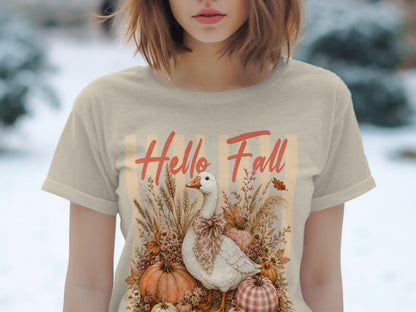 "Hello Fall" text above goose surrounded by pumpkins and fall foliage.