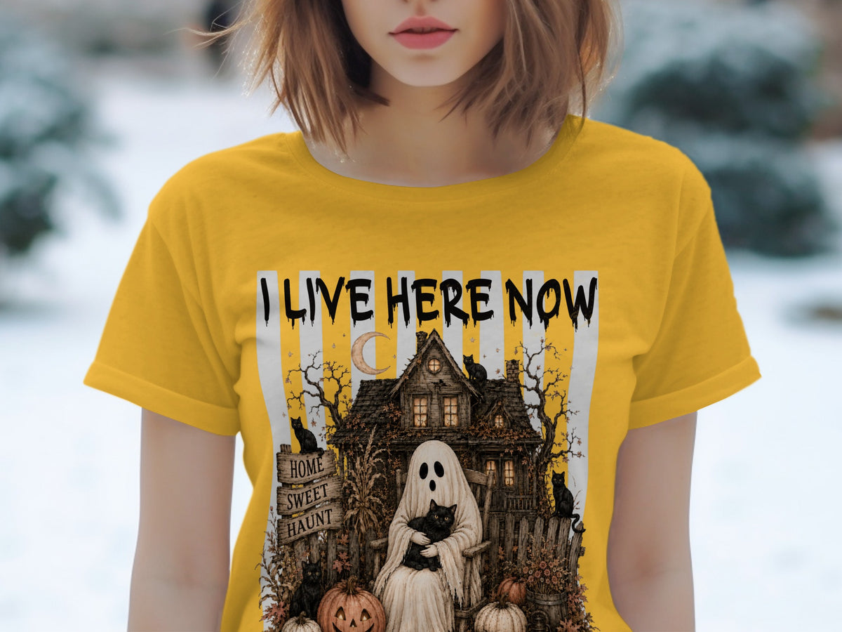 T-shirt with ghost, black cats, haunted house, and "I LIVE HERE NOW" text.