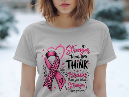 Grey t-shirt with pink breast cancer ribbon and "Stronger than you THINK Braver than you believe Stronger than you seem" text.