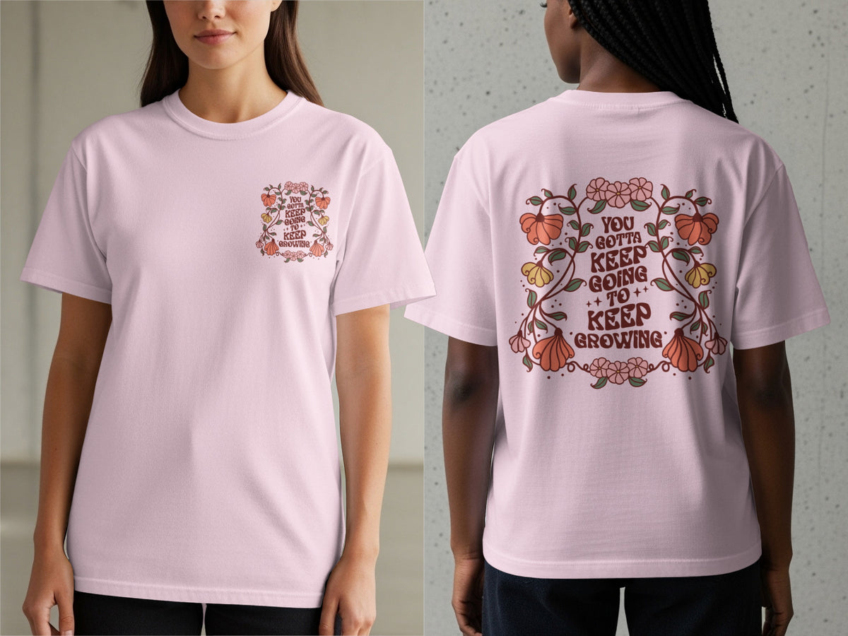 Pink t-shirt with floral graphic and text "You gotta keep going to keep growing".