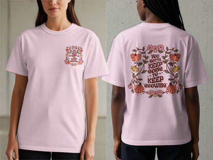 Pink t-shirt with floral graphic and text "You gotta keep going to keep growing".