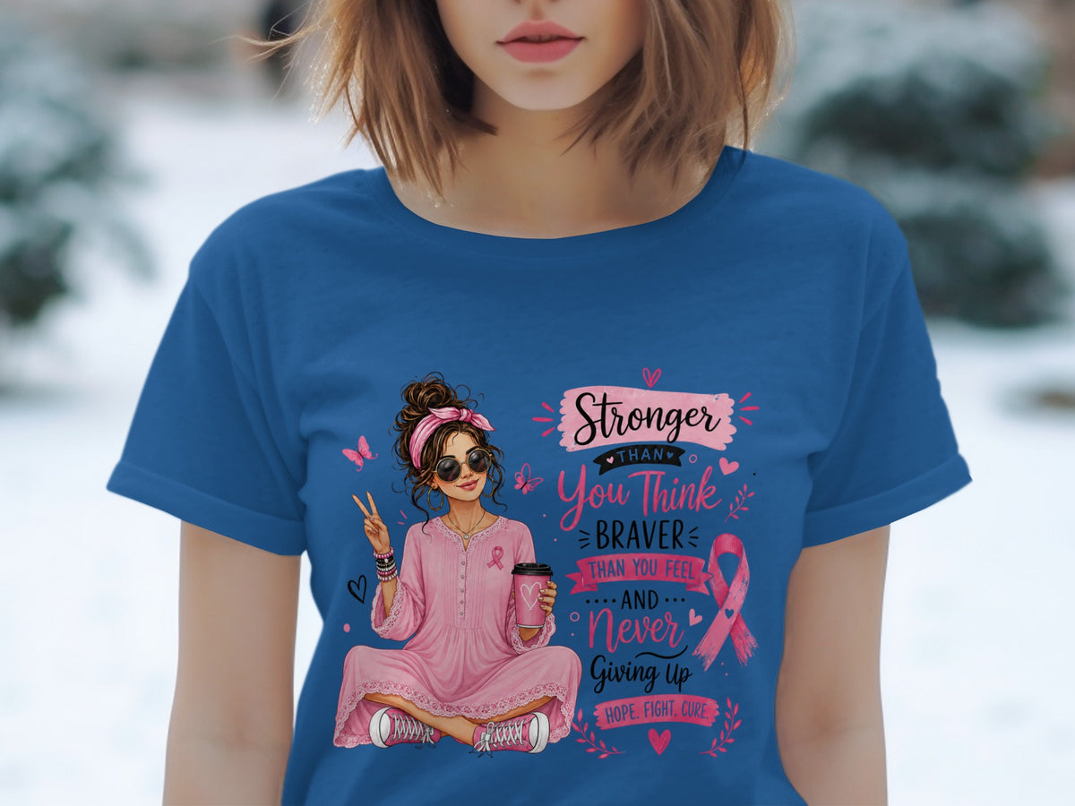 Pink-clad woman with peace sign and coffee holds ribbon, "Stronger Than You Think" text.
