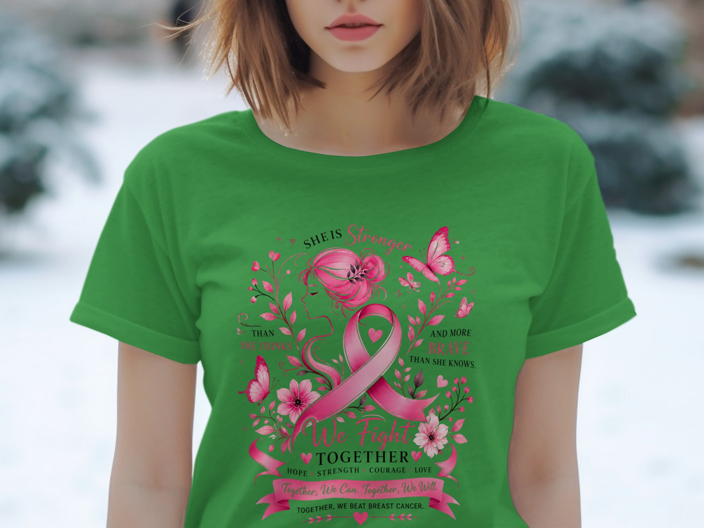 Green t-shirt with pink breast cancer ribbon, butterflies, flowers, and empowering text.