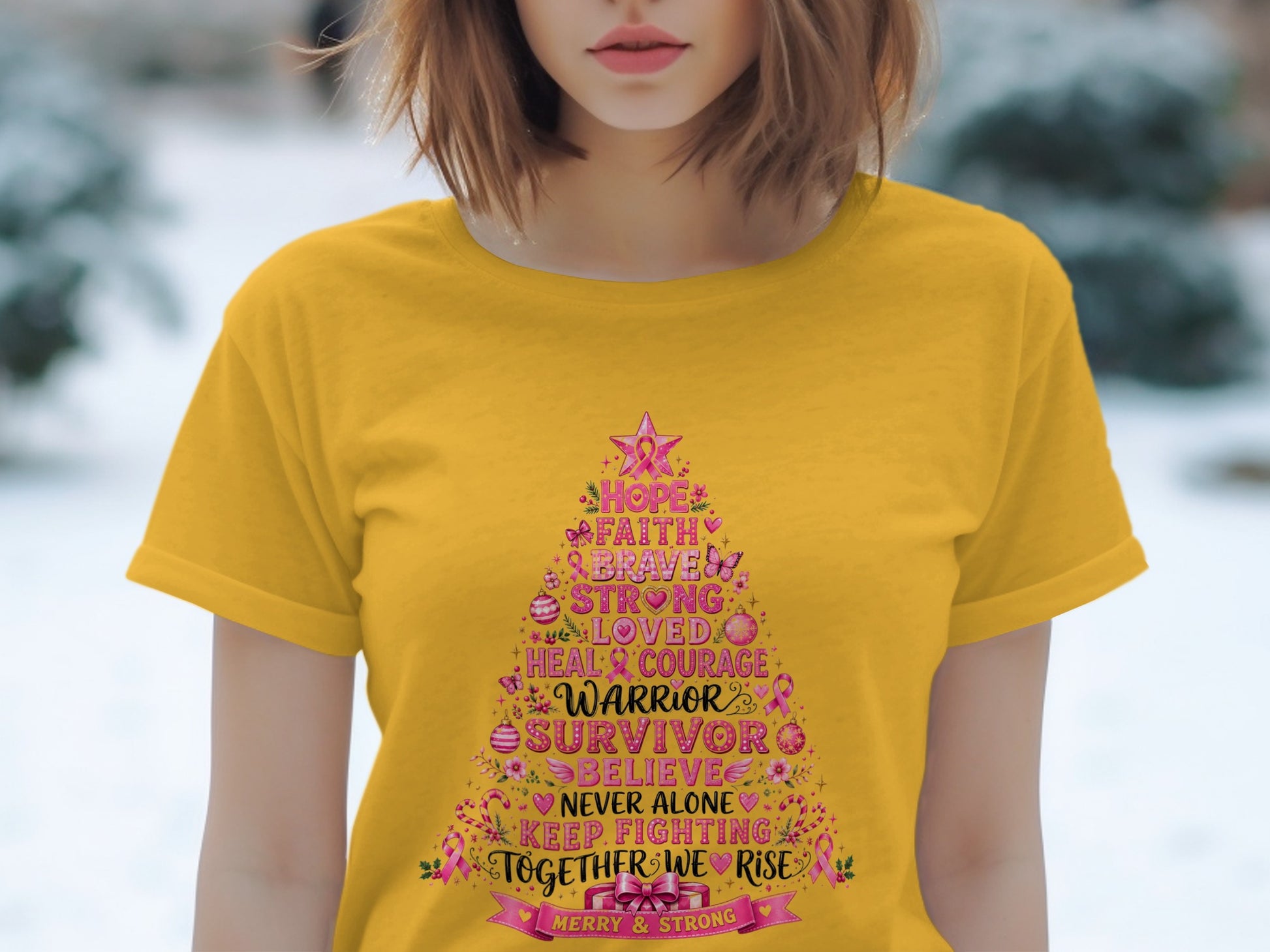 Yellow t-shirt with a pink Christmas tree design listing motivational words and "Warrior Survivor".