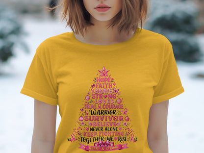 Yellow t-shirt with a pink Christmas tree design listing motivational words and "Warrior Survivor".