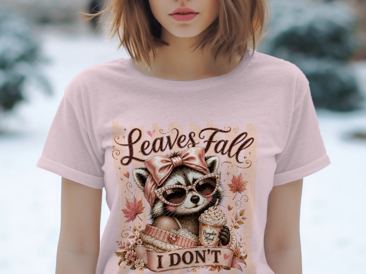 Raccoon with pumpkin spice latte and text "Leaves Fall I Don't".