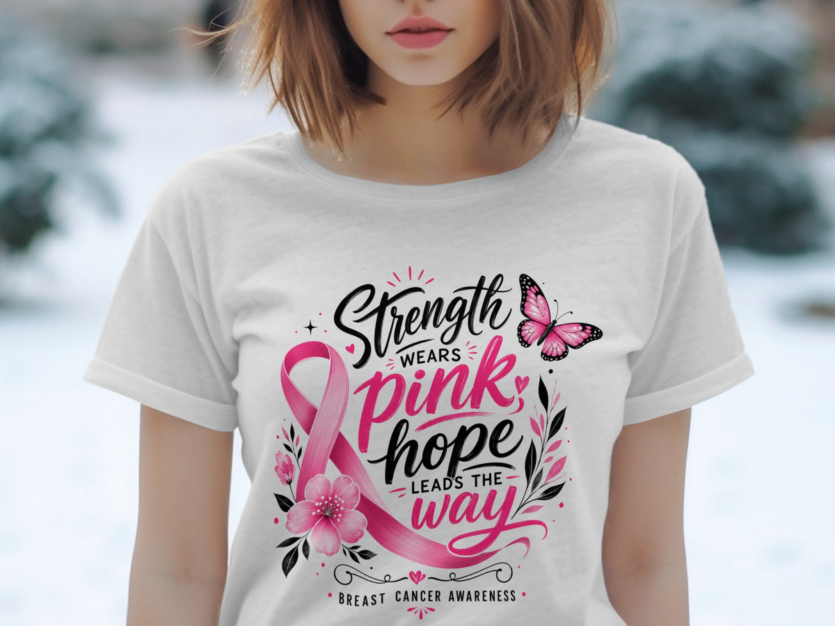 White t-shirt with "Strength Wears Pink, Hope Leads the Way" and breast cancer awareness ribbon.