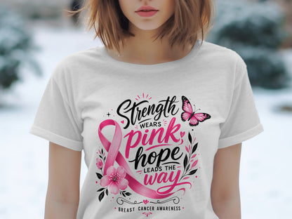 White t-shirt with "Strength Wears Pink, Hope Leads the Way" and breast cancer awareness ribbon.