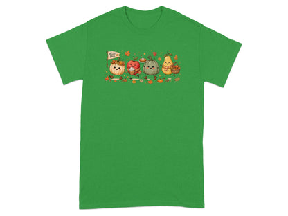 Cartoon pumpkins, apple, and pear with "Hello Fall" flag on a green t-shirt.