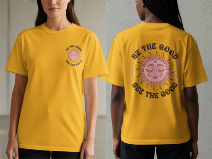 Yellow t-shirt with sun graphic and text "BE THE GOOD SEE THE GOOD."