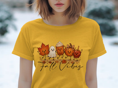 Yellow t-shirt with cartoon fall characters and "Fall Vibes" text.