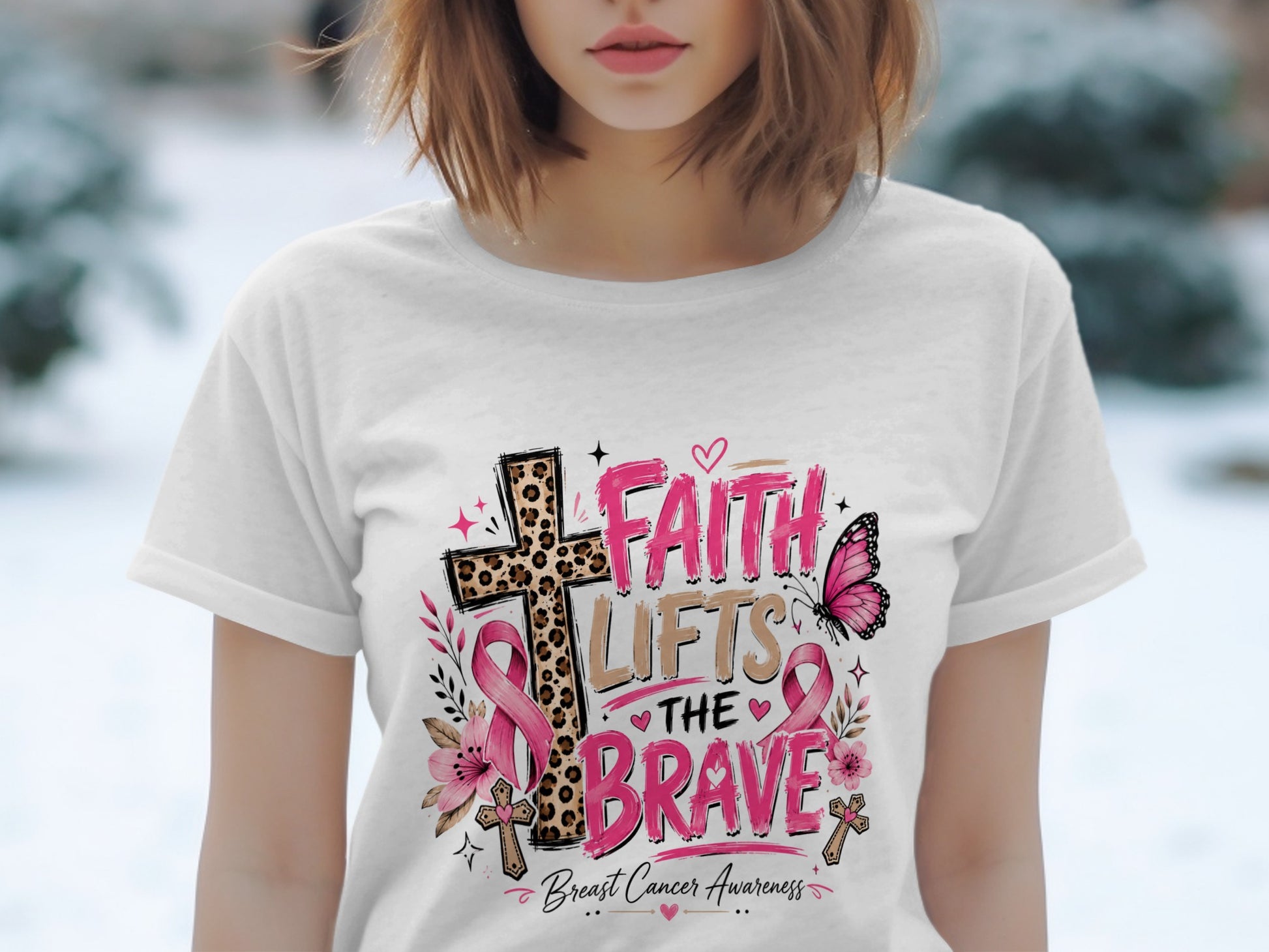 White t-shirt with "Faith Lifts The Brave" Breast Cancer Awareness graphic.