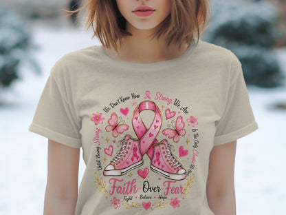 Pink ribbon, butterflies, and shoes with text "Faith Over Fear" and "Strong We Are".
