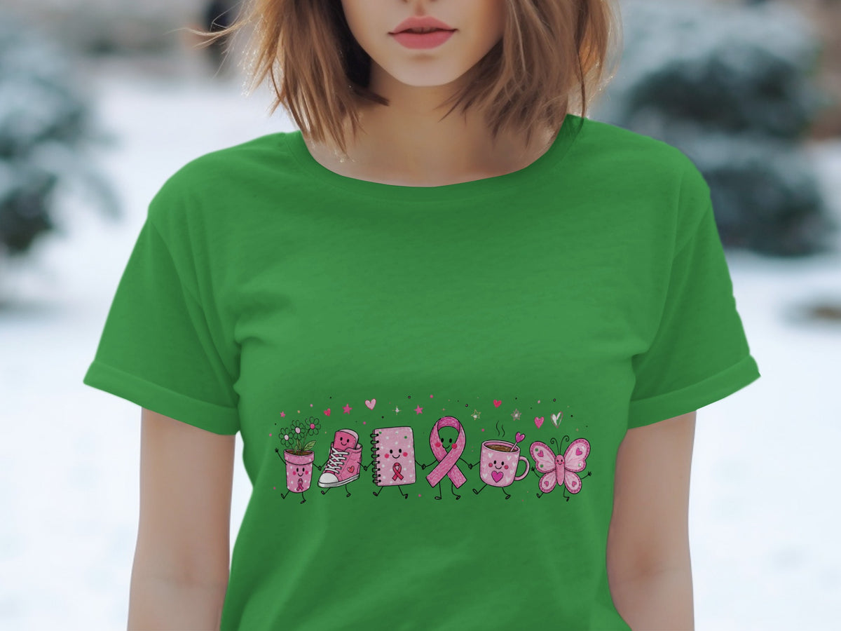 Green t-shirt with a cartoon illustration of various items holding hands, including a potted plant and a pink ribbon.