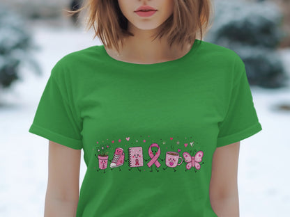 Green t-shirt with a cartoon illustration of various items holding hands, including a potted plant and a pink ribbon.
