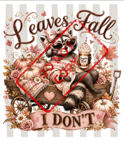 Raccoon in cart with pumpkins, leaves, and drink, "Leaves Fall" and "I DON'T" text.