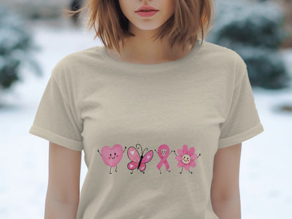 Beige t-shirt with pink heart, butterfly, ribbon, and flower characters.