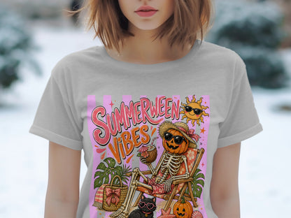 "Summerween Vibes" graphic on a grey t-shirt featuring a skeleton pumpkin on a beach chair.