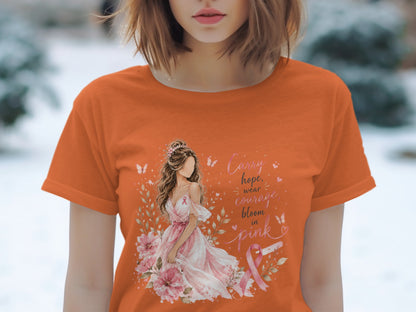 Orange t-shirt with "Carry hope, wear courage, bloom in pink" text.