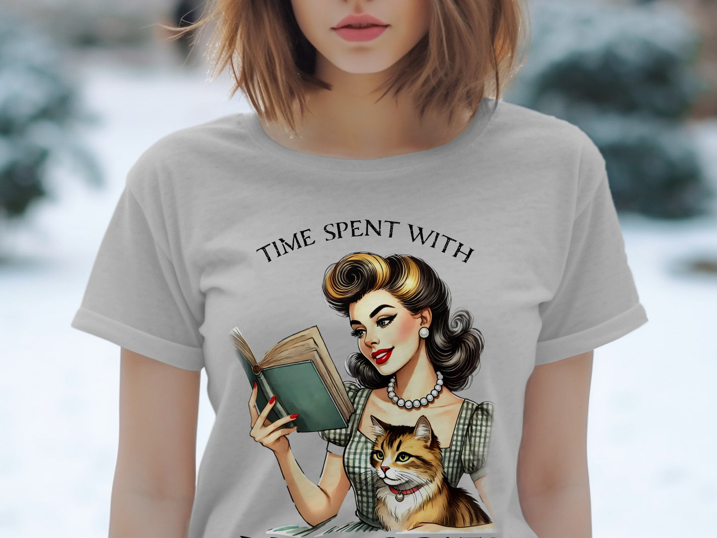 Gray t-shirt with retro illustration of woman reading book with cat, text "TIME SPENT WITH".