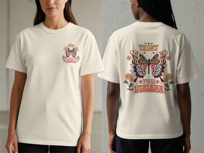 Cream t-shirt with "TRUST YOUR VISIONS" text and butterfly graphic on the back.
