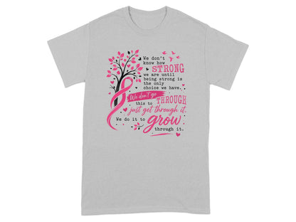 Grey t-shirt with a tree, pink ribbon, birds, and text about being strong.